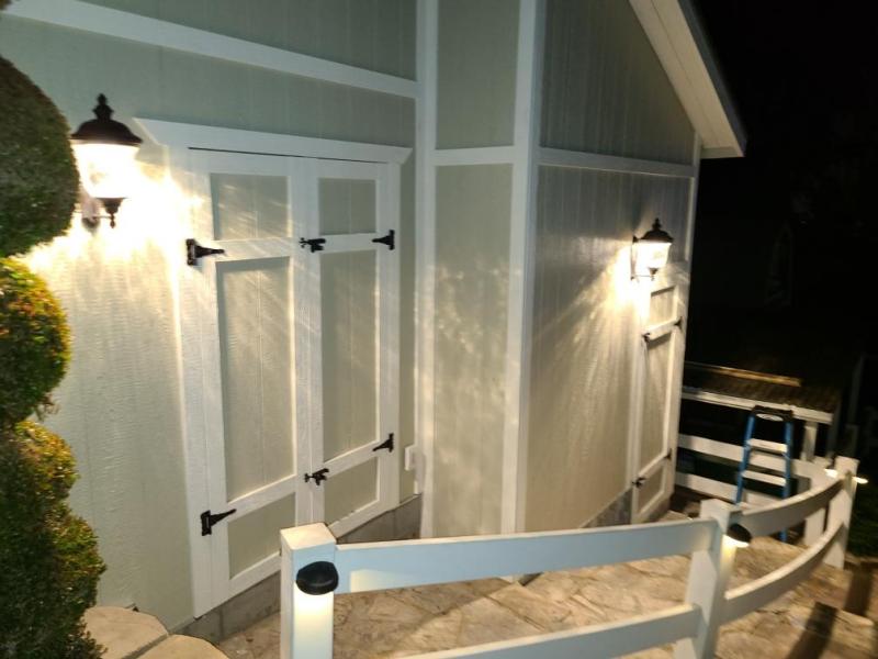 large storage shed with double doors and LED lights on a world wide timers. Custom built paint matches the home